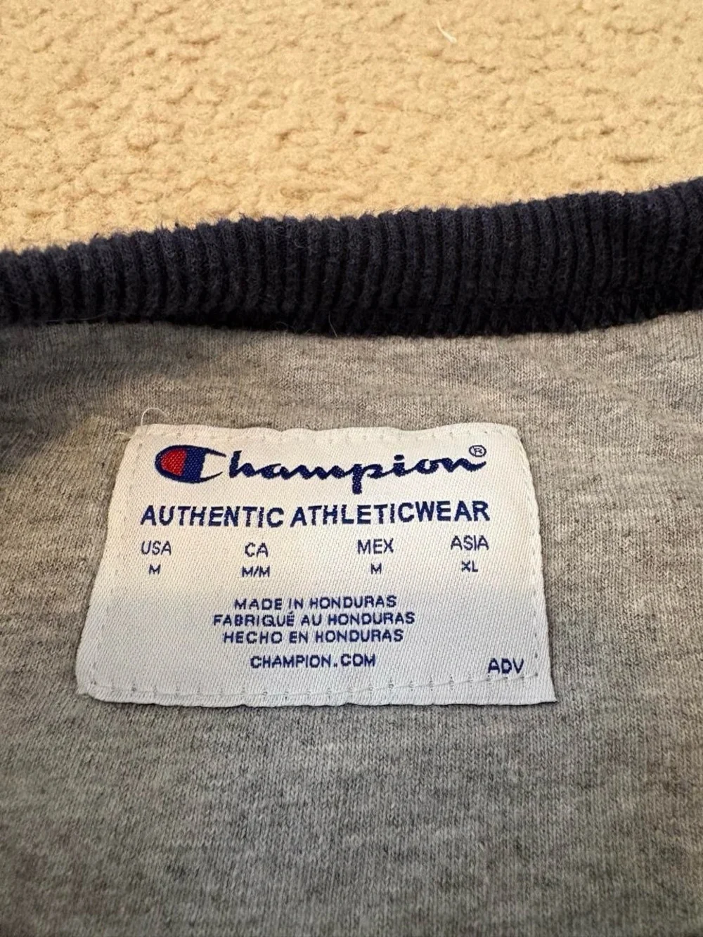 Champion Navy Crewneck Sweatshirt with White Script Logo and Red Accent